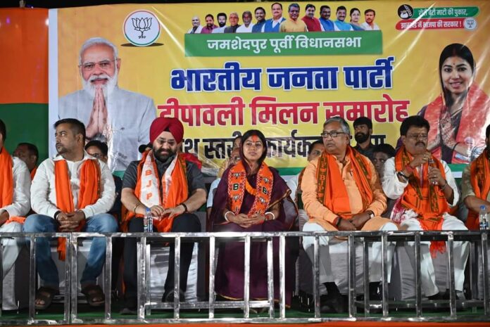 a group of people sitting on a stage